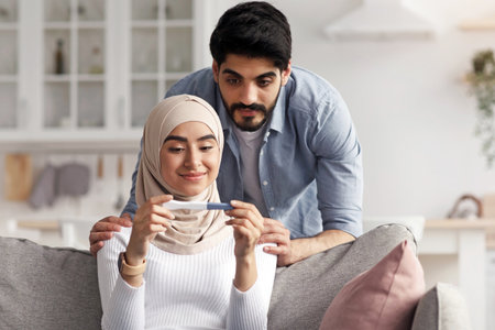 Happy family, planning baby, pregnancy and checking result at homeの写真素材