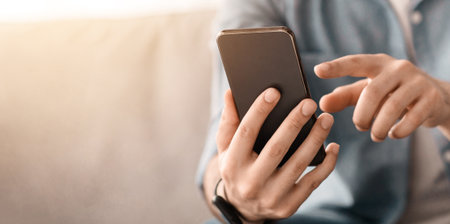 Modern smartphone in unrecognizable man hands. Guy using brand new smartphone, touching screen,...