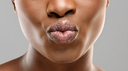 Unrecognizable black girl pouting her beautiful plump lips