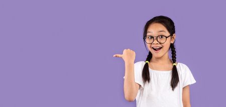 Korean Girl Pointing Thumb At Free Space On Purple Background