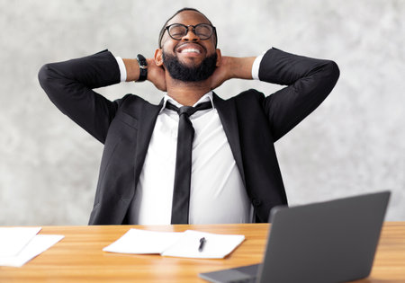 African American man leaning back taking break