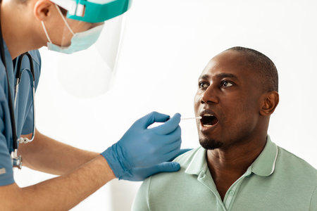 Doctor taking mouth swab from person to test for possible coronavirus infection
