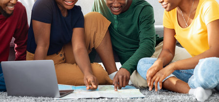Cheerful african american friends looking for destination to travel