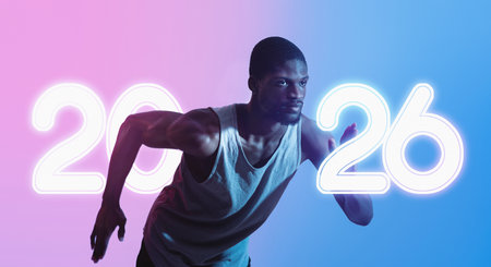 Young Black Sprinter Running Under Vibrant Neon Lights in Preparation for a Race