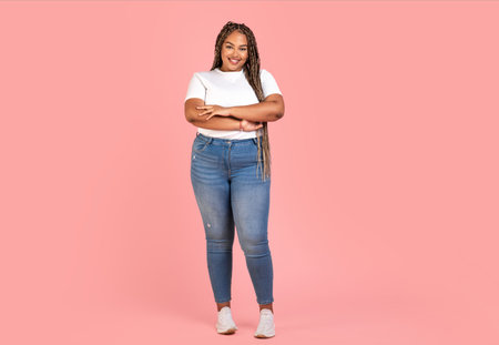Attractive Black Plus Size Woman Model Standing Over Pink Background