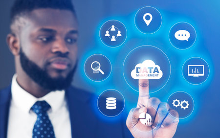 Data Management. African Businessman Choosing Button On Digital Screen With Multimedia Buttons