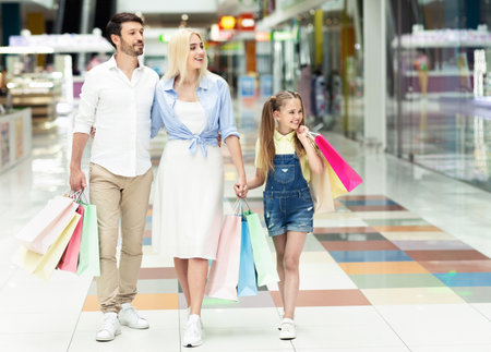 Family Spending Time Together Walking After Shopping In Mallの写真素材