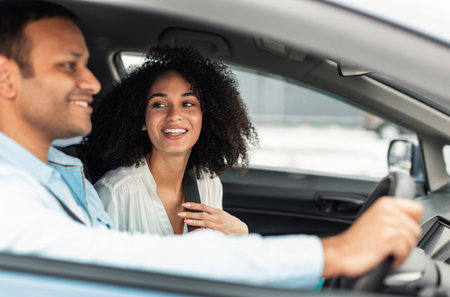 Cheerful Couple Enjoying Car Ride Sitting Inside, Side View