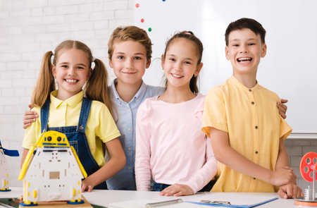 Portrait of pupils building robots in after school stem class