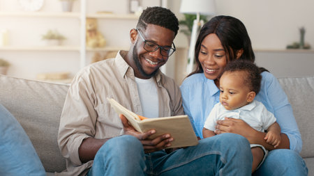 Portrait of happy black family reading book for son