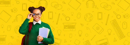 Cheerful Child Stands in School Setting With School Supplies and a Bright Backgroundの写真素材