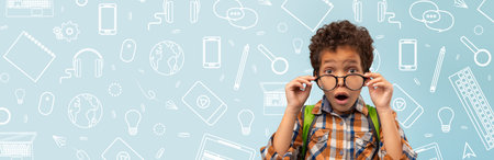Surprised Child With Glasses in School-Themed Collage Background Showing Curiosity and Excitementの写真素材
