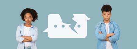 Collage of Two Young People Standing With Crossed Arms in a Simple Designed Settingの写真素材