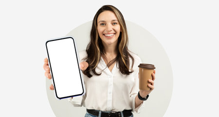 Smiling Woman Holding a Smartphone and a Coffee Cup in a Bright and Cheerful Setting