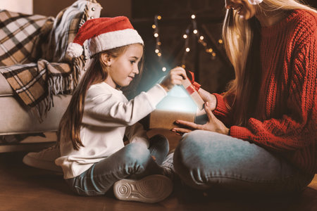 Portrait of happy woman and daughter celebrating xmasの写真素材