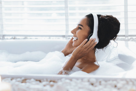 Relaxation and Joy During a Bubble Bath With Headphones Onの写真素材