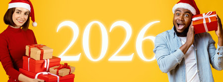 Celebration of 2026 With Friends Holding Gifts Against a Bright Yellow Backgroundの写真素材