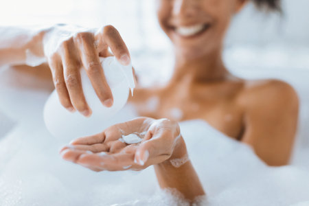 Relaxing Bath Time With Bubbles and Skincare Routine in a Bright Bathroomの写真素材