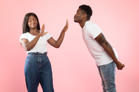 Man Attempts Unwanted Kiss as Woman Shows Clear Rejection in Humorous Friendzone Momentの写真素材