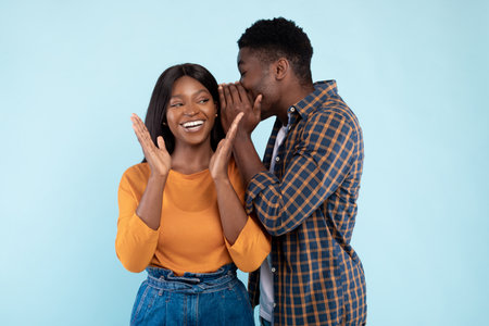 Young Couple Sharing Exciting News, Woman Amazed, Cheerful Atmosphere in Studio Setting