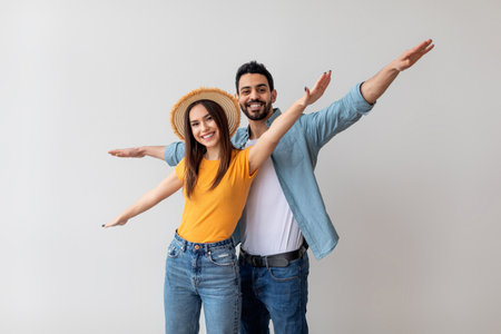 Couple Having Fun Together in Casual Style With Smiles on Their Faces in Bright Indoor Settingの写真素材