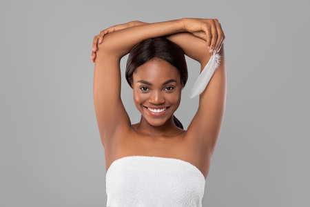 Woman Smiles Confidently While Showcasing Personal Care and Grooming in a Serene Indoor Setting
