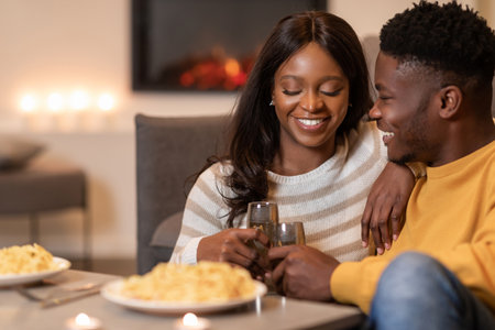 Romantic Indoor Dinner Celebration With Loving Spouses Toasting Glasses During Valentineâs Dayの写真素材
