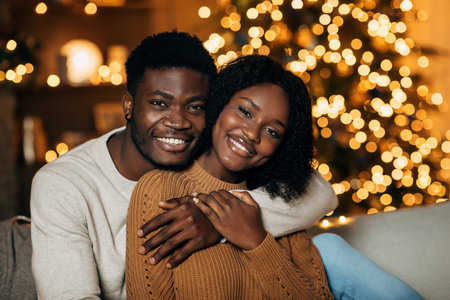Loving African American Couple Embraces in Beautifully Decorated Room on Christmas Eveの写真素材