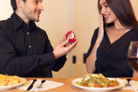 Couple Enjoys Romantic Dinner as a Surprise Proposal Happens at an Intimate Restaurant Setting