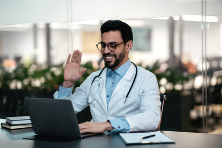 Healthcare Professional Engages in Virtual Consultation While Smiling and Waving at a Patient in Modern Office Settingの写真素材