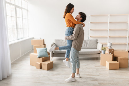 Joyful Young Couple Enjoys Moving Day Together in New Home