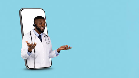 Telemedicine Concept. Black Doctor In Headset Peeking Out Of Big Smartphone Screenの写真素材