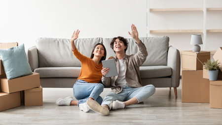 Millennial Couple Dreams of New Home Design While Surrounded by Moving Boxes