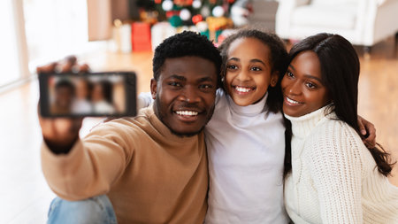Happy African American Family Takes a Joyful Selfie During Christmas Celebration at Home