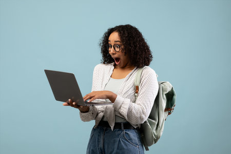 Young Black Woman Feels Excitement During Online Learning Session at Home