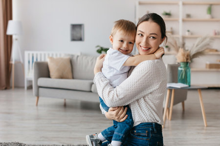 Mother and Son Share a Joyful Moment in a Cozy Living Room Filled With Natural Light and a Warm...