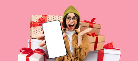 Excited Person Holding Smartphone Surrounded by Gift Boxes in a Cheerful Setting