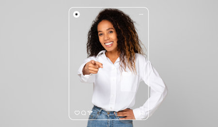 Collage of a Smiling Woman Pointing in an Online Frame Against a Simple Backgroundの写真素材