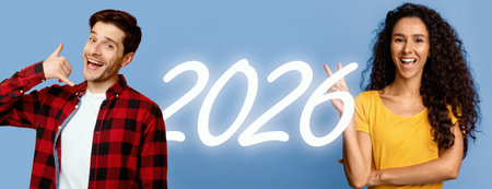 Confident Young Woman Poses With Folded Arms Against Background While Smilingの写真素材