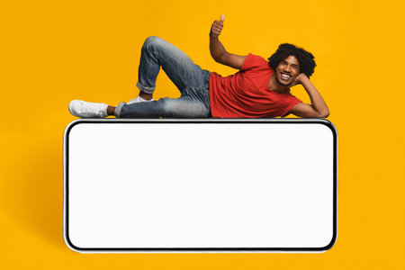 Person Posing on Large Smartphone Device With a Bright Yellow Background
