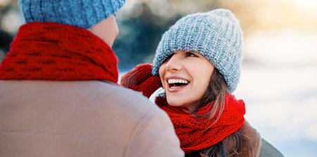 Joyful Winter Moments in a Snowy Landscape Shared by Two Friends Wearing Warm Clothing
