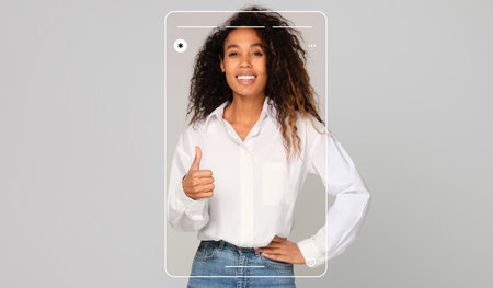 Happy Woman Giving a Thumbs up in a Simple, Modern Setting With a Clean Background