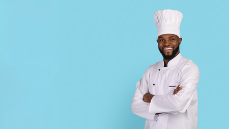 Portrait Of Smiling African American Chef Wearing Uniform Standing With Folded Arms