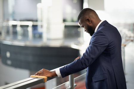African american entrepreneur standing by railingの写真素材