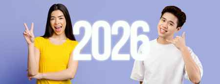 Confident Young Asian Woman and Man Posing With Smiles Against a Purple Backdropの写真素材