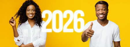 Confident Young Woman and Man Smiling With Thumbs up in Front of Bright Yellow Backgroundの写真素材