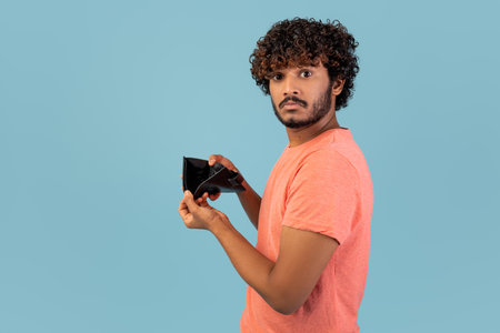 Indian Man Shows Empty Wallet Conveying Financial Struggle During Pandemic Crisis