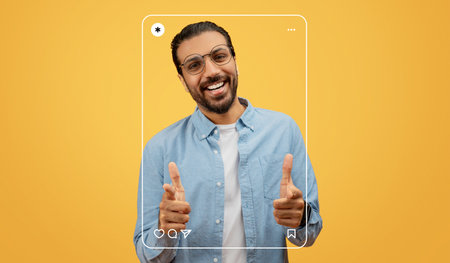 Man Smiling and Posing in a Bright Setting With a Cheerful Expression and Playful Gesturesの写真素材