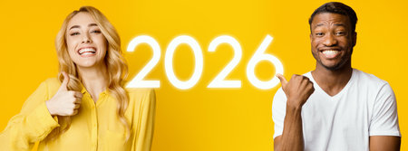 Confident Millennial Girl and Young Man Posing Together With Smiles on a Bright Yellow Backgroundの写真素材