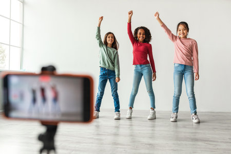 Three Diverse Girls Creating Fun Video Content Indoors for Their Blog